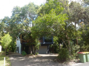 8 Belle Court - Rainbow Shores - Relax on the deck overlooking bushland whilst listening to the waves crash on the shore